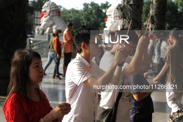 Buddhists are carrying out worship and prayers to coincide with Vesak Day 2024 at Maha Vihara Maitreya, Medan Estate, Deli Serdang Regency,...