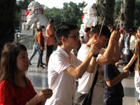 Buddhists are carrying out worship and prayers to coincide with Vesak Day 2024 at Maha Vihara Maitreya, Medan Estate, Deli Serdang Regency,...