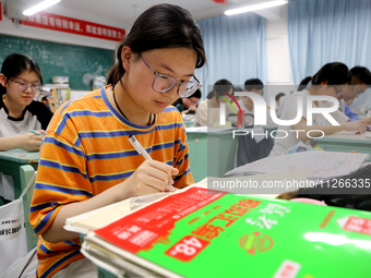 Students who are about to take the National College entrance examination are taking evening self-study in the classroom of Lianyungang Senio...