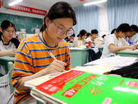 Students who are about to take the National College entrance examination are taking evening self-study in the classroom of Lianyungang Senio...