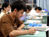 Students who are about to take the National College entrance examination are taking evening self-study in the classroom of Lianyungang Senio...