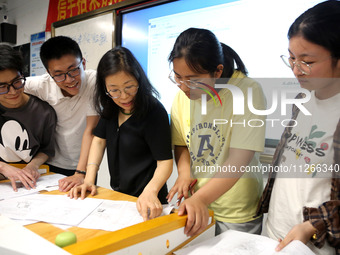 Students who are about to take the National College entrance examination are taking evening self-study in the classroom of Lianyungang Senio...