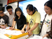 Students who are about to take the National College entrance examination are taking evening self-study in the classroom of Lianyungang Senio...