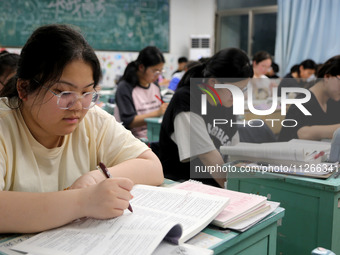 Students who are about to take the National College entrance examination are taking evening self-study in the classroom of Lianyungang Senio...