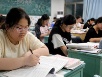 Students who are about to take the National College entrance examination are taking evening self-study in the classroom of Lianyungang Senio...