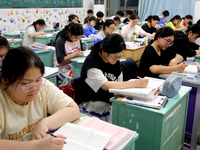 Students who are about to take the National College entrance examination are taking evening self-study in the classroom of Lianyungang Senio...