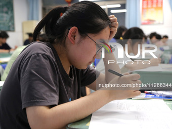 Students who are about to take the National College entrance examination are taking evening self-study in the classroom of Lianyungang Senio...