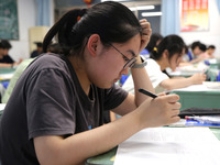 Students who are about to take the National College entrance examination are taking evening self-study in the classroom of Lianyungang Senio...