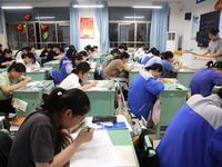 Students who are about to take the National College entrance examination are taking evening self-study in the classroom of Lianyungang Senio...