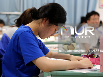 Students who are about to take the National College entrance examination are taking evening self-study in the classroom of Lianyungang Senio...