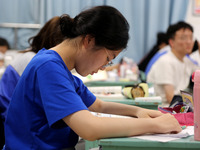 Students who are about to take the National College entrance examination are taking evening self-study in the classroom of Lianyungang Senio...