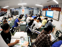 Students who are about to take the National College entrance examination are taking evening self-study in the classroom of Lianyungang Senio...