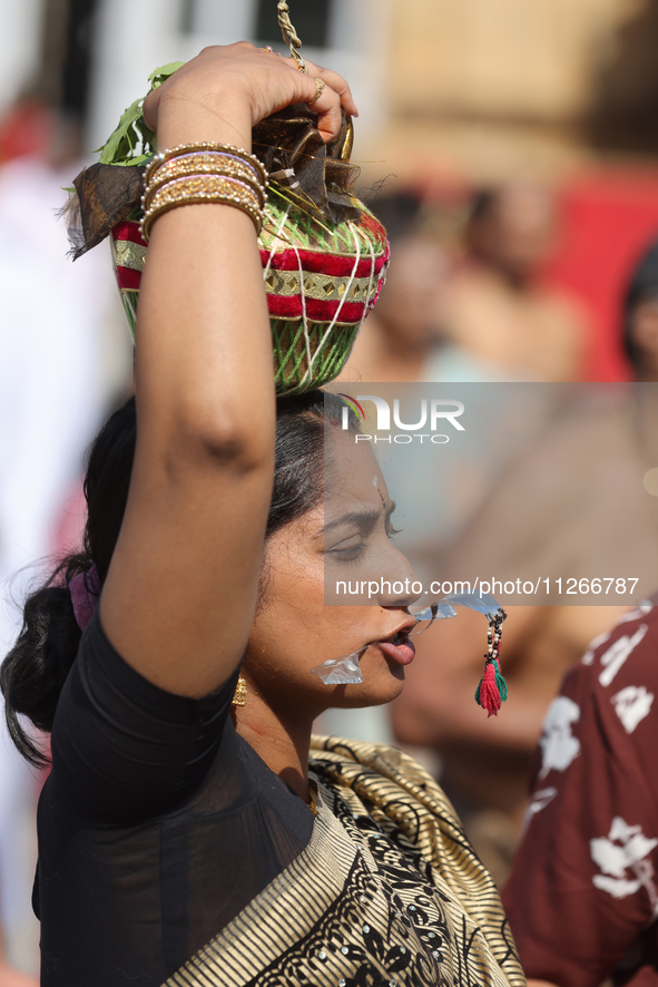 Tamil Hindu devotees are taking part in the chariot procession (ther) during the Ganesha Mahotshava Vingnapanam Festival at the Ganesh Templ...