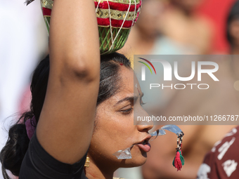 Tamil Hindu devotees are taking part in the chariot procession (ther) during the Ganesha Mahotshava Vingnapanam Festival at the Ganesh Templ...