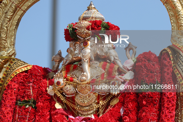 Tamil Hindu devotees are taking part in the chariot procession (ther) during the Ganesha Mahotshava Vingnapanam Festival at the Ganesh Templ...