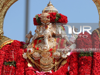 Tamil Hindu devotees are taking part in the chariot procession (ther) during the Ganesha Mahotshava Vingnapanam Festival at the Ganesh Templ...