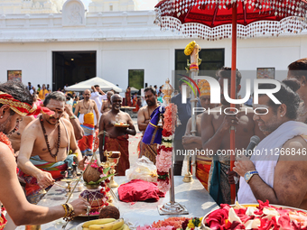 Hindu priests are reciting prayers as Tamil Hindu devotees are taking part in the chariot procession (ther) during the Ganesha Mahotshava Vi...