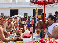 Hindu priests are reciting prayers as Tamil Hindu devotees are taking part in the chariot procession (ther) during the Ganesha Mahotshava Vi...