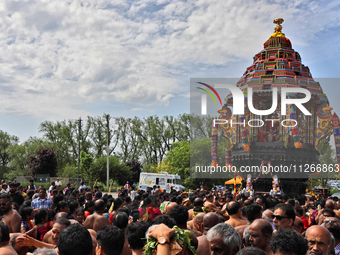 Tamil Hindu devotees are taking part in the chariot procession (ther) during the Ganesha Mahotshava Vingnapanam Festival at the Ganesh Templ...