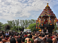 Tamil Hindu devotees are taking part in the chariot procession (ther) during the Ganesha Mahotshava Vingnapanam Festival at the Ganesh Templ...