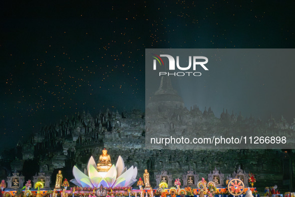 Thousands of lanterns are illuminating the night sky above Borobudur Temple, creating a breathtaking view. Each lantern is symbolizing hope...