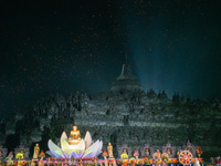 Thousands of lanterns are illuminating the night sky above Borobudur Temple, creating a breathtaking view. Each lantern is symbolizing hope...