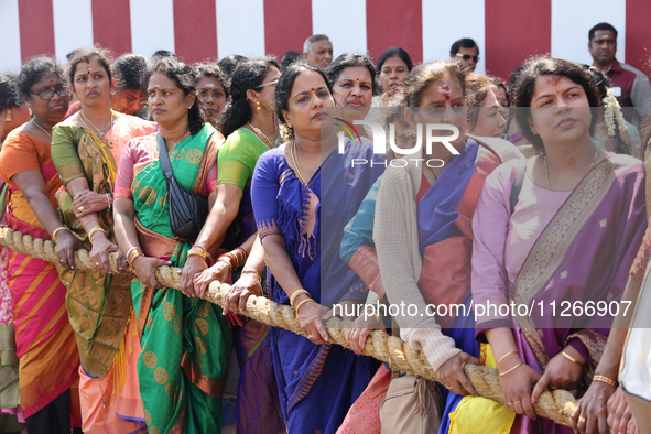 Women are pulling the chariot as Tamil Hindu devotees are taking part in the chariot procession (ther) during Ganesha Mahotshava Vingnapanam...