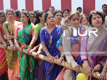 Women are pulling the chariot as Tamil Hindu devotees are taking part in the chariot procession (ther) during Ganesha Mahotshava Vingnapanam...