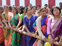 Women are pulling the chariot as Tamil Hindu devotees are taking part in the chariot procession (ther) during Ganesha Mahotshava Vingnapanam...