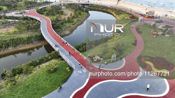 Tourists and citizens are enjoying themselves on the Sunshine Coast Greenway in Rizhao, China, on May 23, 2024. 