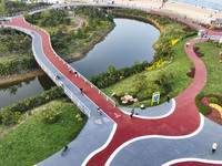 Tourists and citizens are enjoying themselves on the Sunshine Coast Greenway in Rizhao, China, on May 23, 2024. (