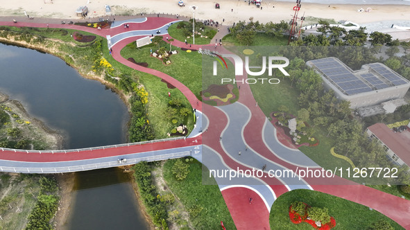 Tourists and citizens are enjoying themselves on the Sunshine Coast Greenway in Rizhao, China, on May 23, 2024. 