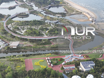 Tourists and citizens are enjoying themselves on the Sunshine Coast Greenway in Rizhao, China, on May 23, 2024. (