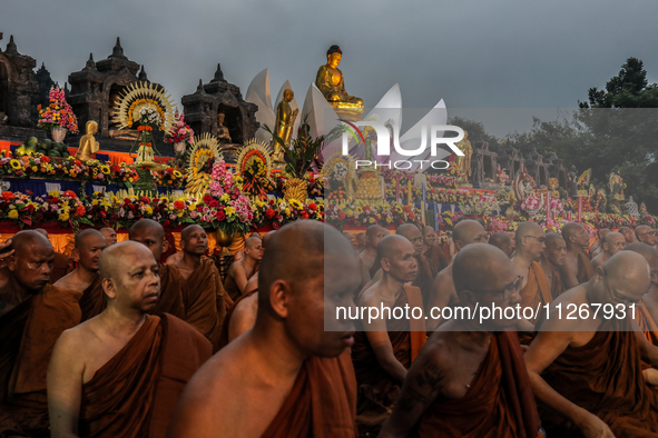 Buddhist monks are offering prayers at the celebration of Vesak Day 2568 B.E. at Borobudur Temple in Magelang, Central Java, on May 23, 2024...