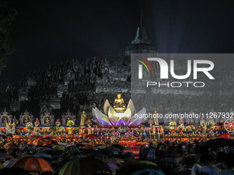 Buddhists are offering prayers during the celebration of Vesak Day 2568 B.E. at Borobudur Temple in Magelang, Central Java, on May 23, 2024...