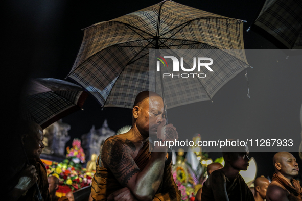 Buddhist monks are offering prayers at the celebration of Vesak Day 2568 B.E. at Borobudur Temple in Magelang, Central Java, on May 23, 2024...