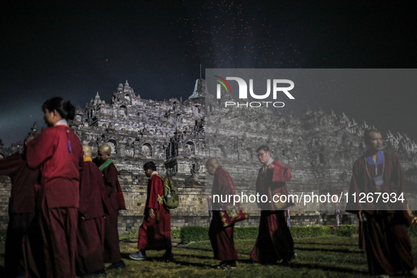 Buddhist monks are offering prayers at the celebration of Vesak Day 2568 B.E. at Borobudur Temple in Magelang, Central Java, on May 23, 2024...