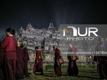 Buddhist monks are offering prayers at the celebration of Vesak Day 2568 B.E. at Borobudur Temple in Magelang, Central Java, on May 23, 2024...