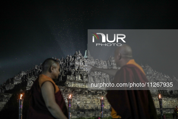 Buddhist monks are looking at the lanterns of Vesak Day 2568 B.E. at Borobudur Temple in Magelang, Central Java, on May 23, 2024. 