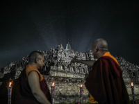 Buddhist monks are looking at the lanterns of Vesak Day 2568 B.E. at Borobudur Temple in Magelang, Central Java, on May 23, 2024. (