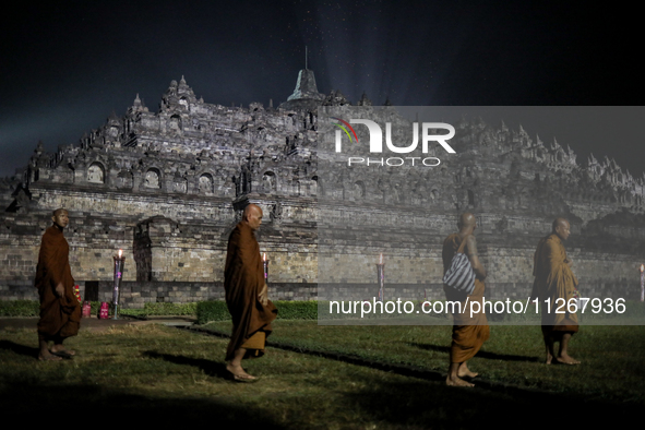 Buddhist monks are offering prayers at the celebration of Vesak Day 2568 B.E. at Borobudur Temple in Magelang, Central Java, on May 23, 2024...