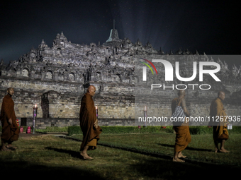 Buddhist monks are offering prayers at the celebration of Vesak Day 2568 B.E. at Borobudur Temple in Magelang, Central Java, on May 23, 2024...