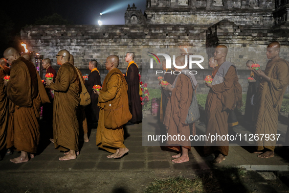 Buddhist monks are offering prayers at the celebration of Vesak Day 2568 B.E. at Borobudur Temple in Magelang, Central Java, on May 23, 2024...