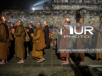 Buddhist monks are offering prayers at the celebration of Vesak Day 2568 B.E. at Borobudur Temple in Magelang, Central Java, on May 23, 2024...