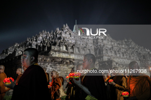 Buddhist monks are offering prayers at the celebration of Vesak Day 2568 B.E. at Borobudur Temple in Magelang, Central Java, on May 23, 2024...