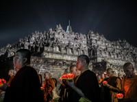 Buddhist monks are offering prayers at the celebration of Vesak Day 2568 B.E. at Borobudur Temple in Magelang, Central Java, on May 23, 2024...