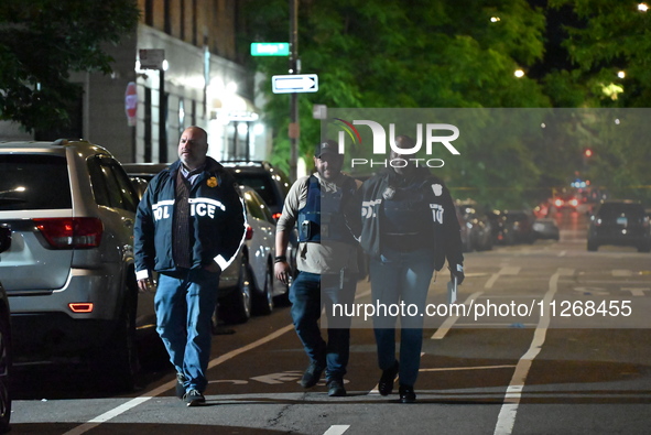 Police officers are gathering at the scene. Three people are being shot, and two people are dead in a shooting in Bronx, New York, United St...