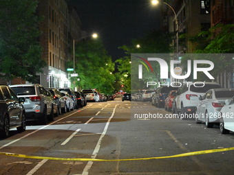 Police tape is blocking the area of the crime scene. Three people are being shot, with two people dead, in a shooting in Bronx, New York, Un...