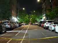 Police tape is blocking the area of the crime scene. Three people are being shot, with two people dead, in a shooting in Bronx, New York, Un...