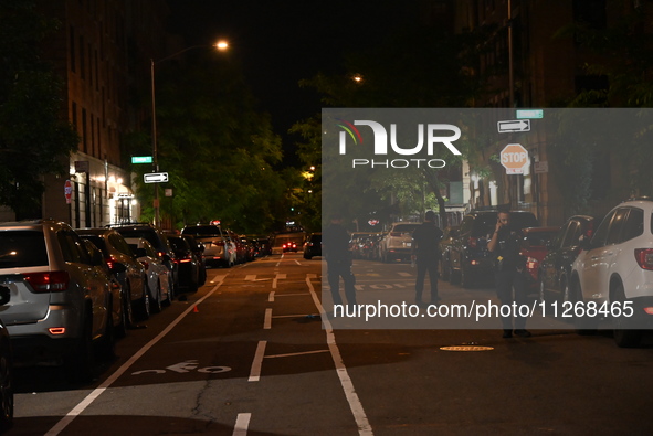 Police tape is blocking the area of the crime scene. Three people are being shot, with two people dead, in a shooting in Bronx, New York, Un...